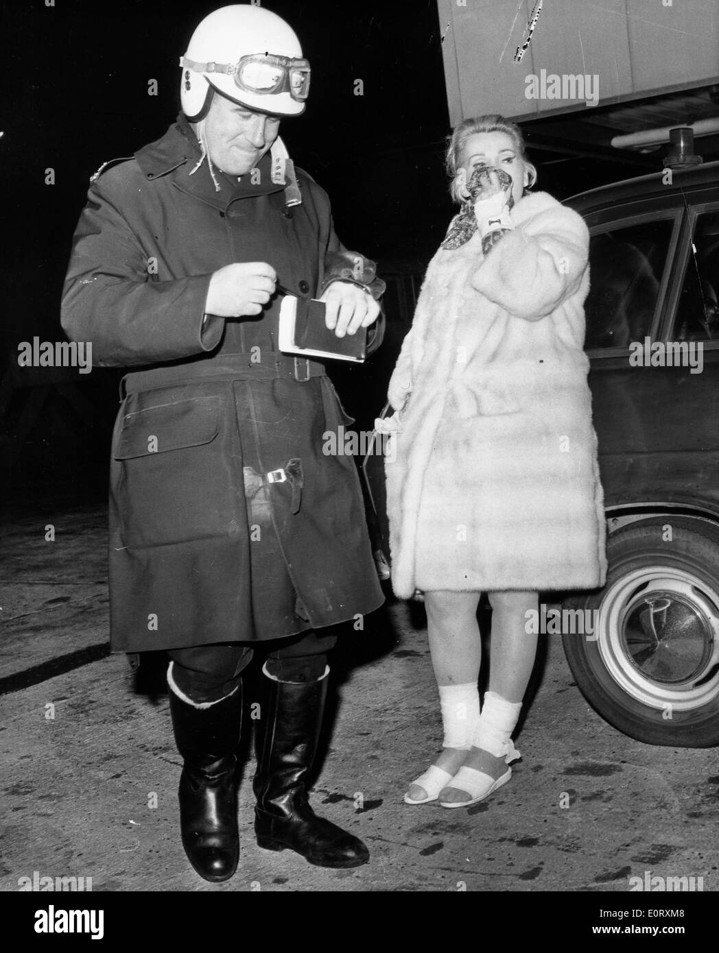 Zsa Zsa Gabor in tears with a policeman Stock Photo