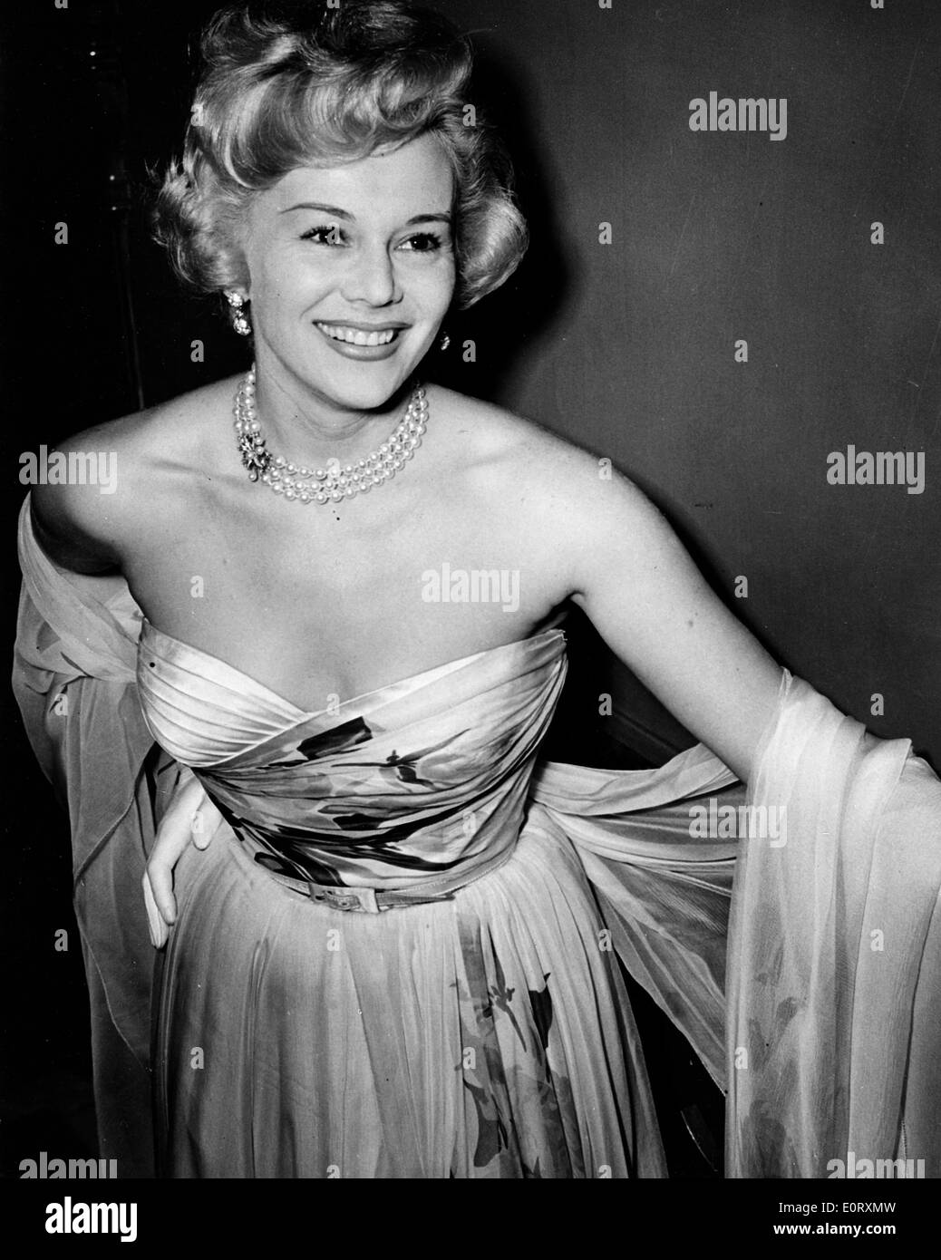 Actress Zsa Zsa Gabor in a gown at a party Stock Photo - Alamy