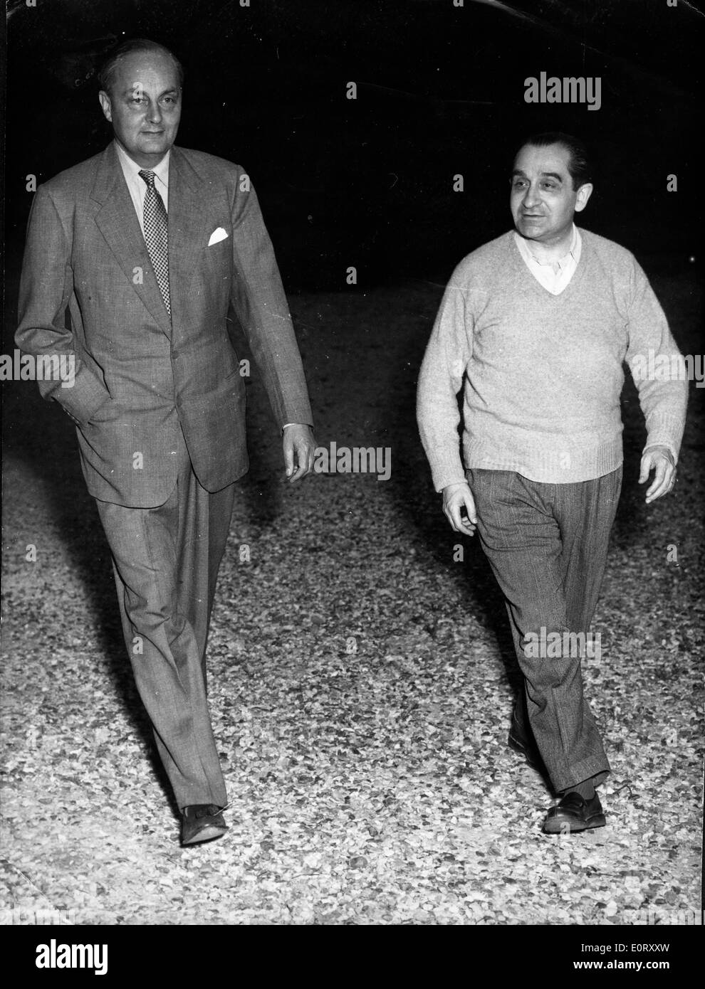 French politician PIERRE MENDES FRANCE, right, walks with a man. Stock Photo