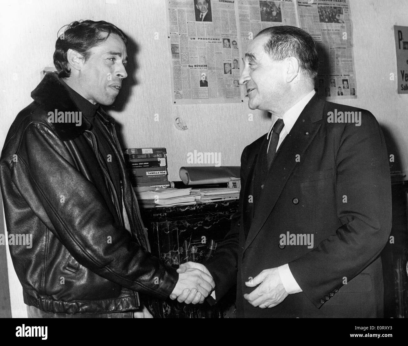 French politician PIERRE MENDES-FRANCE, right, shakes hands with a man. Stock Photo
