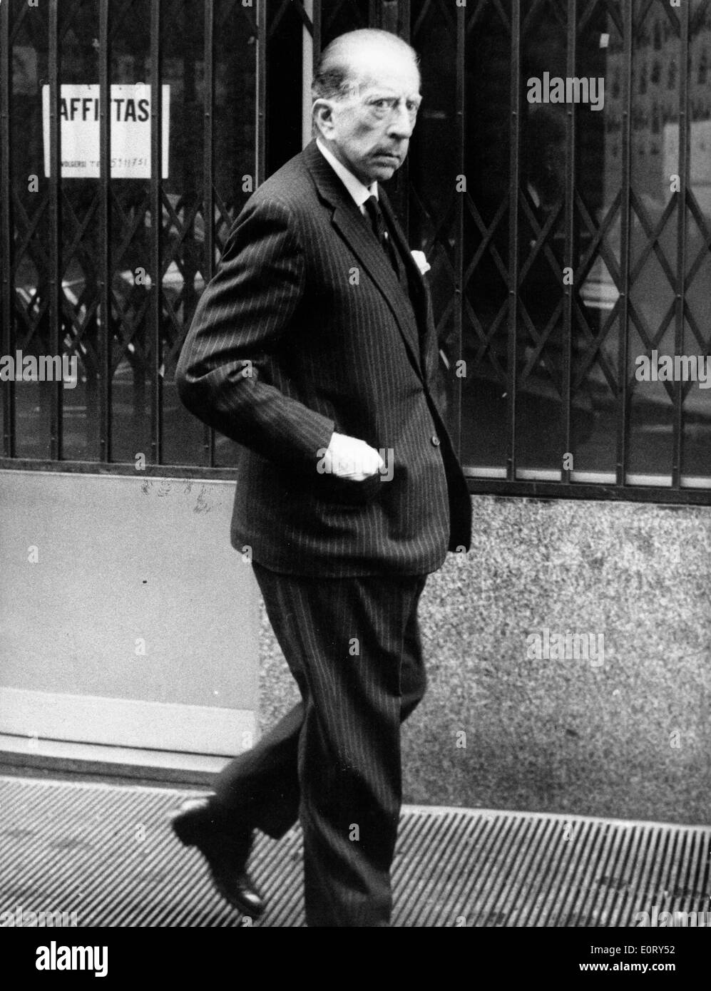 Industrialist J. Paul Getty walks down the sidewalk Stock Photo