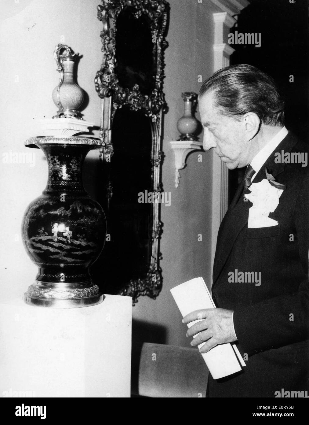 Industrialist J. Paul Getty admires a vase Stock Photo