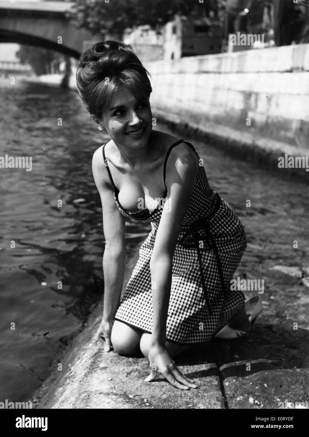 Actress Valerie la Grange sitting down by the river Stock Photo