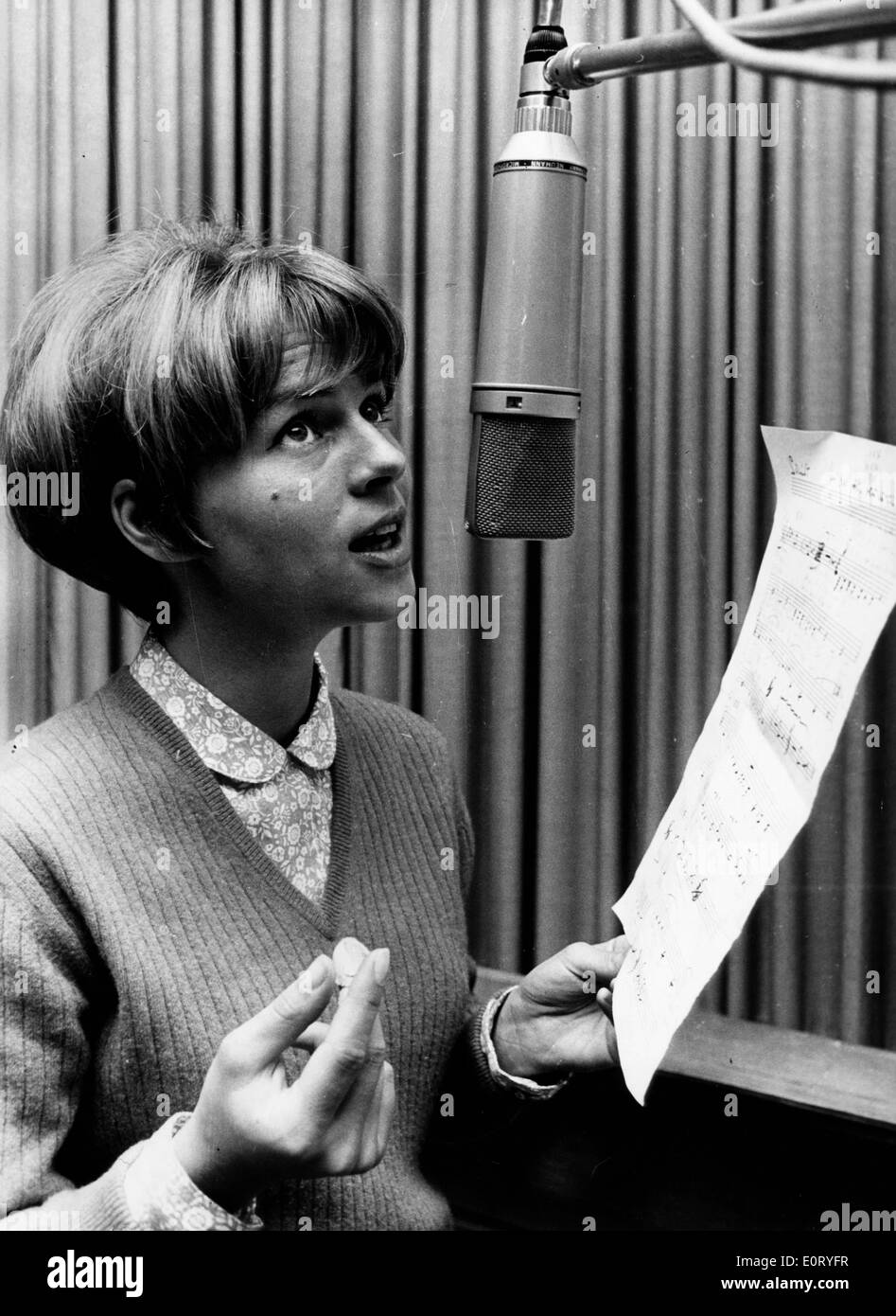 Actress Conny Froboess sings in recording studio Stock Photo