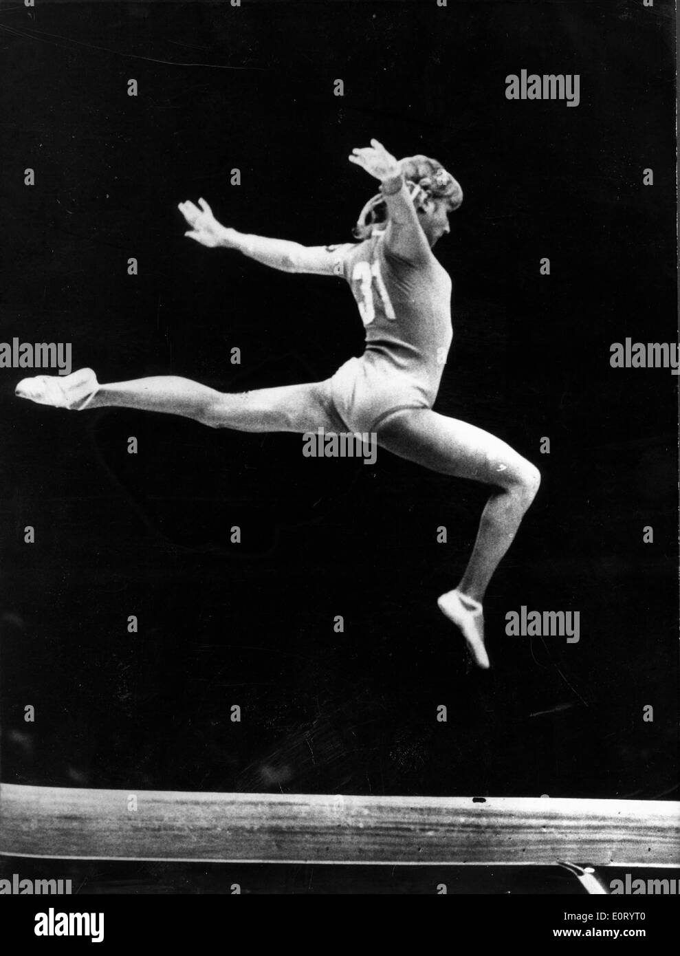 Gymnast Olga Korbut jumps during competition Stock Photo