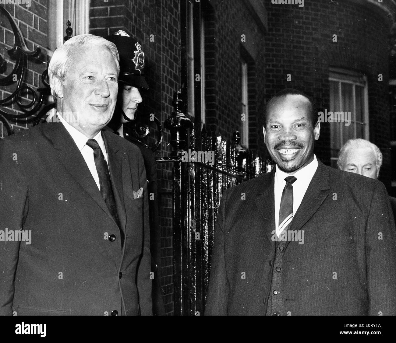 First president of Botswana SERETSE KHAMA  smiles on the street lined with brick buildings. Stock Photo