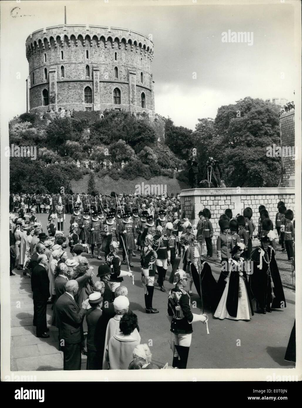 Jun. 06, 1960 - Queen At Garter Ceremony: Four new Knights Companions of the Most Noble Order of the Garter were invested by H.M. The Queen, who is Sovereign of the Order, at Windsor Castle today. The four new Knights Companions are Field Marshall Sir William Slim; The Duke of Northumberland; The Earl of Radnor, and Lord Digby. Photo shows General view showing H.M. The Queen and Prince Philip in procession to St. George's Chapel at Windsor Castle today, showing the Round Tower in the background. Stock Photo