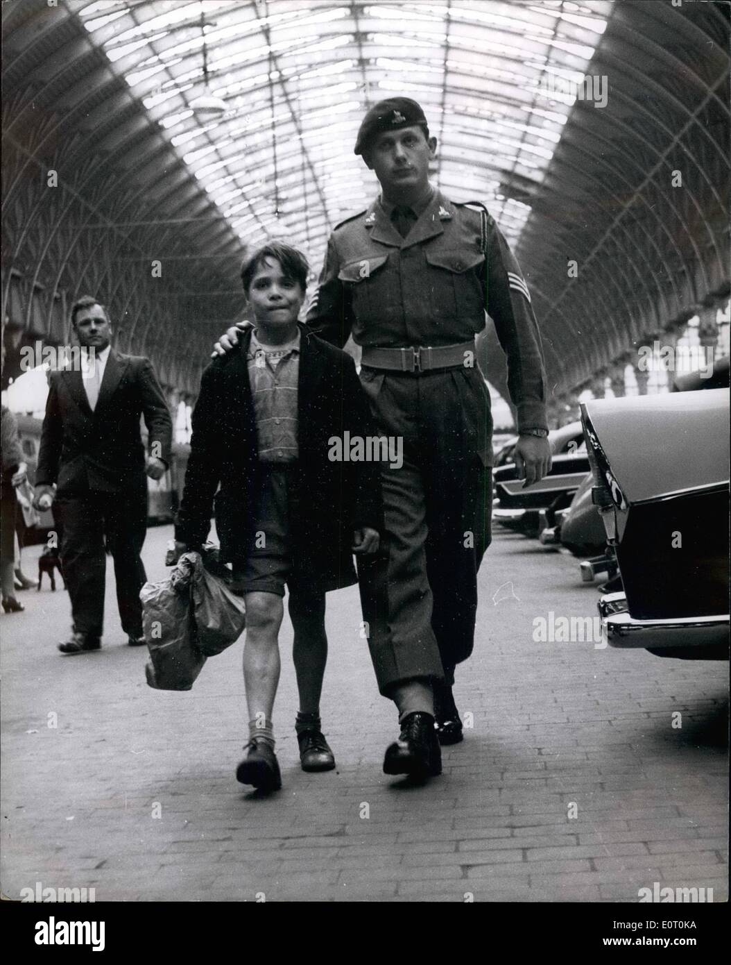 Jun. 06, 1960 - 11-year old Colin quits the Army: Colin Nash, the Army's youngest ever recruit, was given an honourable discharge yesterday, after three days ''service'', and because of his age he's only 11 he was taken back to London by Sergeant Sid Andrews and handed over to his mother. Colin's Army career began last Friday at Waller Barrackes in Wiltshire. He was takne there by his big brother, Private Peter Nash. Peter arrived holding his kitbag in one hand and Coling in the other. He explained: ''Colins's my favourite brother. I just couldn't leave him behind in London Stock Photo