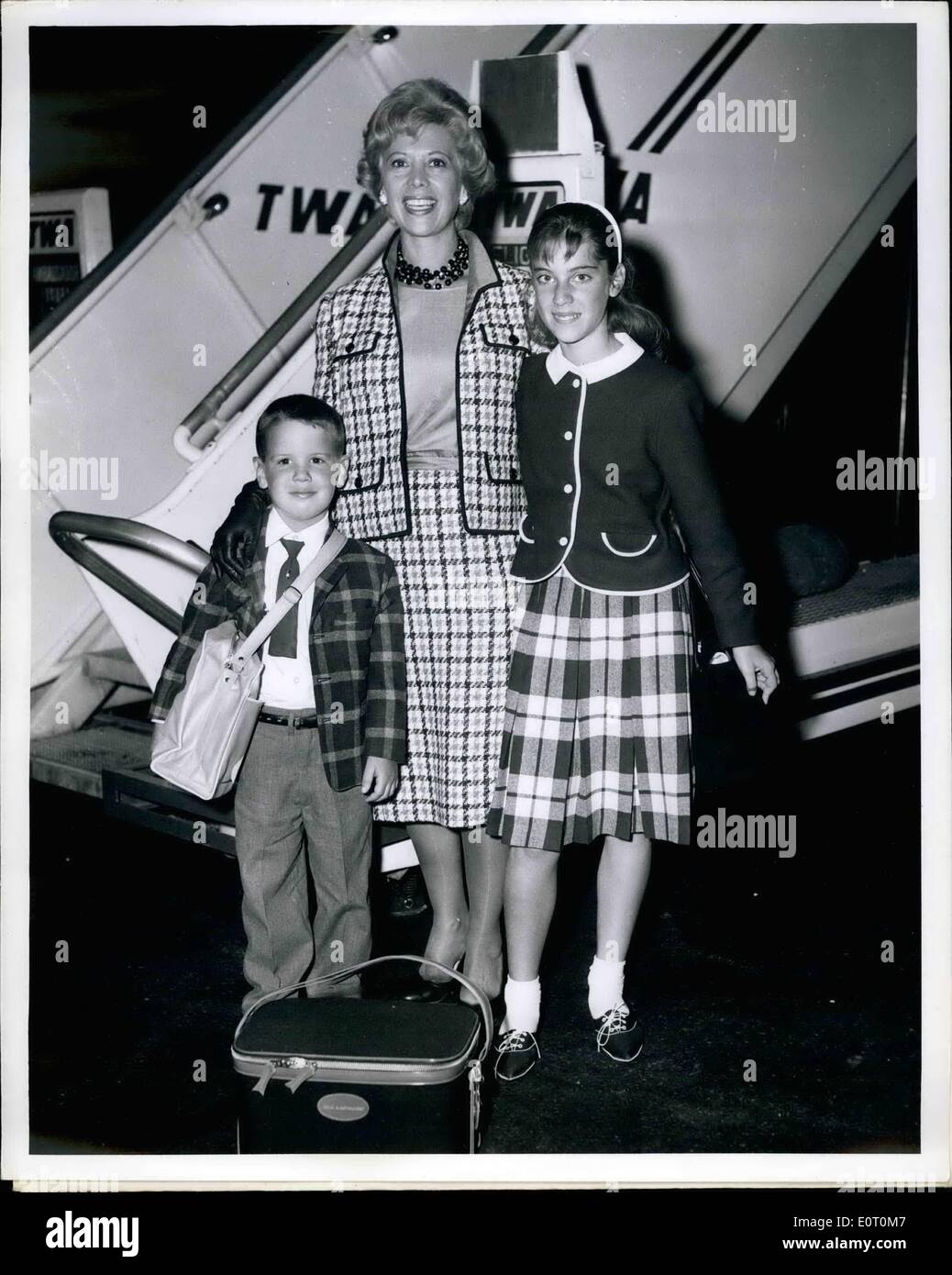 Jun. 06, 1960 - N.Y. International Airport: Popular songbird Dinah Shore is pictured on Arrival with her children, Milisa (on her left) and her son Jody from Los Angeles Via TWA's intercontinental superjet. Mrs. George Montgomery in real life and the children will be away for two weeks in Copenhagen where she will shoot TV films for her Chevy Show. Stock Photo