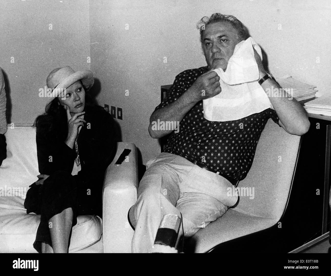 Director Federico Fellini wiping his face Stock Photo