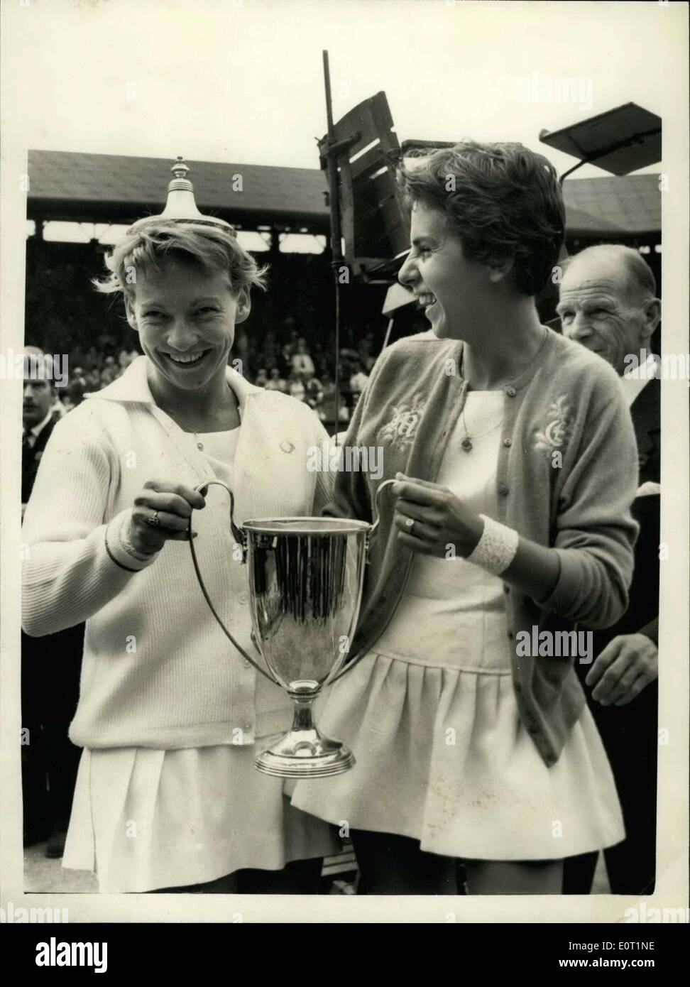 Jul. 02, 1960 - Women's Doubles final at Wimbledon. Fun with the cup. Photo shows Darlene Hard (USA) has a spot of fun by placing the lid of the Ladies Doubles Trophy - which she and Maria Bueno (Brazil) won by beating the south African Pair - Miss Reynolds and Miss Schuurman - at Wimbledon this afternoon. Stock Photo