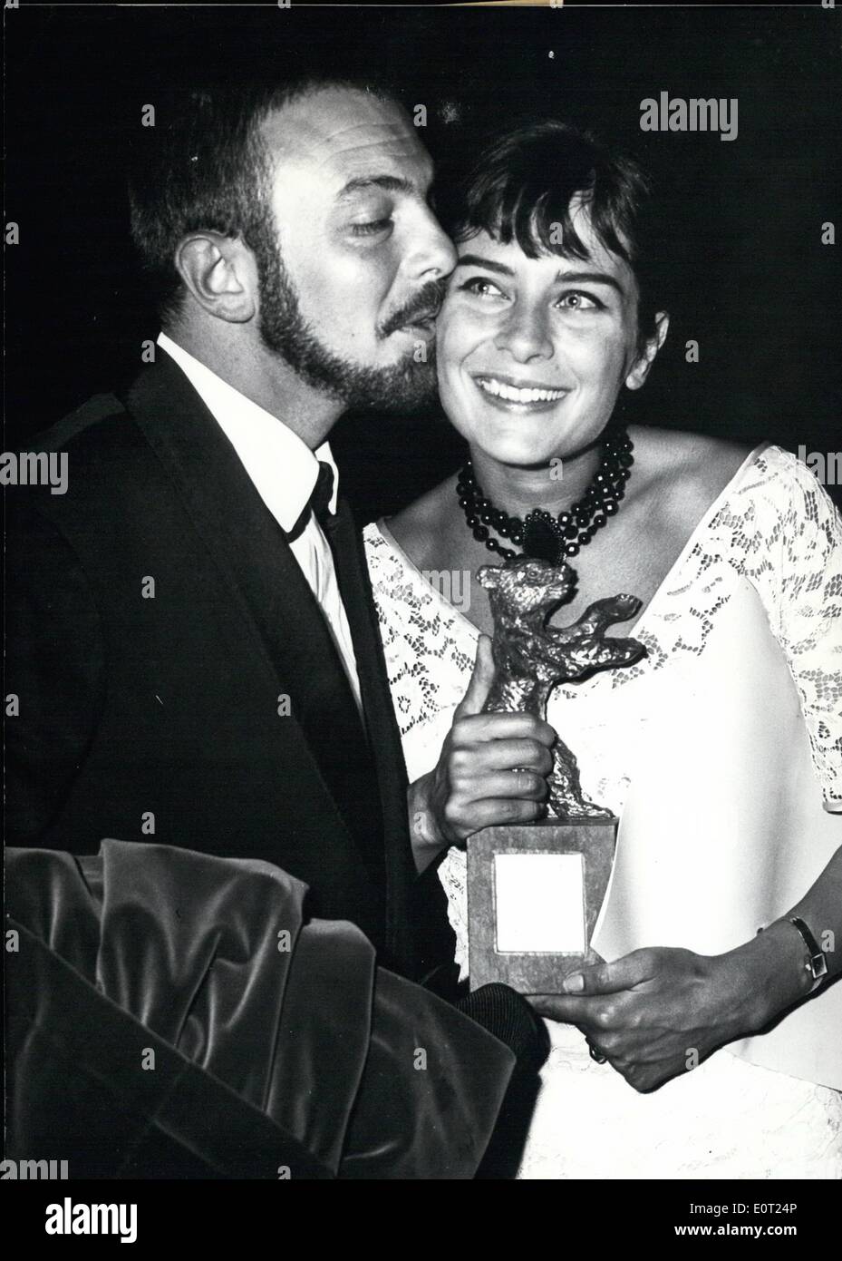 Jul. 07, 1960 - Presentation of International film prizes: As conclusion of the Berlin Film Festival 1960 in the evening of July 5th, 1960 the film prizes Golden and Silver Bears'' were presented. For the best female part the French fil actress Juliette Mayniel (Juliette Mayniel) was awarded a ''Silver Bear'' (she had played the main part in the German film ''Kirmes''). Photo shows Juliette Mayniel is happily showing her prize to her husband, the French journalist Robert Auboymeau (Robert Auboymeau) who spontanously gave her a kiss of appreciation. Stock Photo