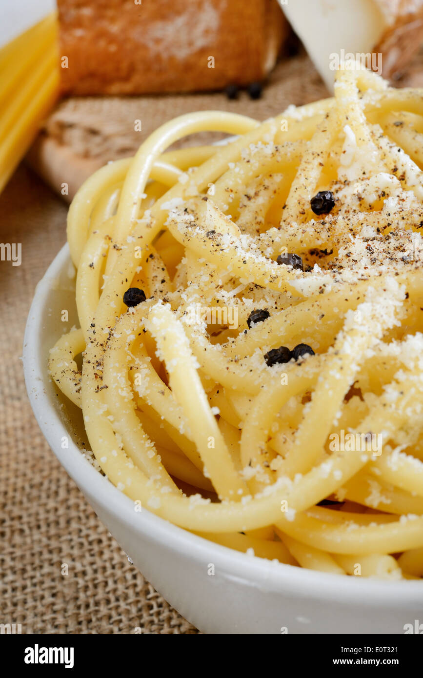 italian pasta bucatini with pecorino cheese and black pepper Stock