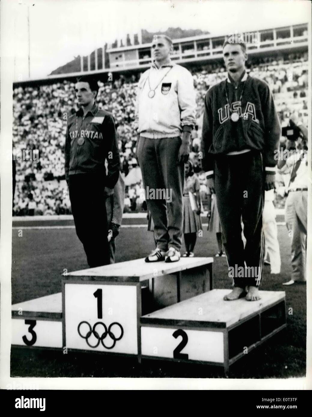 Sep. 09, 1960 - Olympic Games In Rome Bronze Medal For Radford in 100 meters Final; Armin Hart, of Germany, the world record holder, today won the Olympic 100 meters Final in 10.2 secs. which equaled the Olympic record he set up yesterday. Dave Sime (U.S.A), was second, and Peter Radford of Great Britain, was third. Photo Shows Picture on the rostrum after the presentation of medals are Armin Hary, centre (Gold Medal); Dave Sime, (on right - Silver Medal). and Peter Radford (left-Bronze Medal). in Rome Italy. Stock Photo