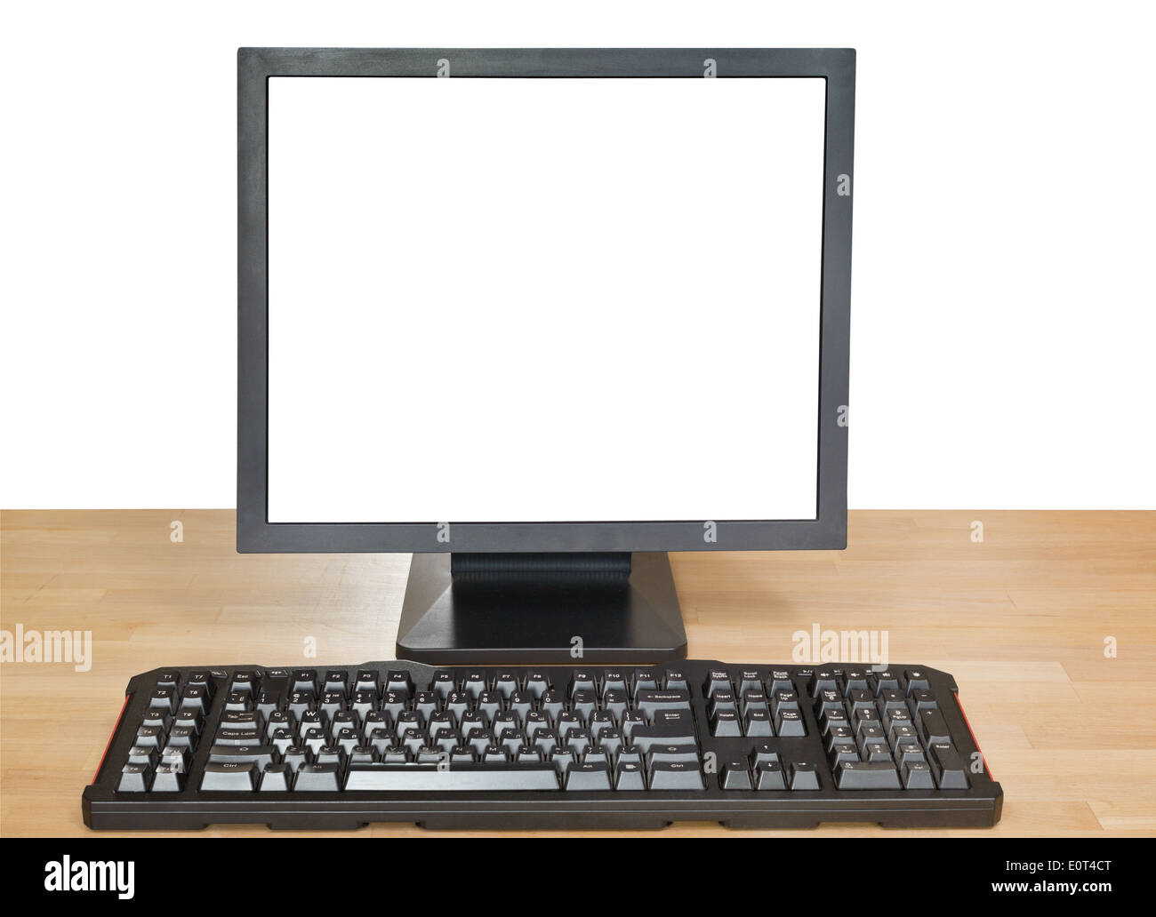 front view of black display with cut out screen and keyboard on wooden ...