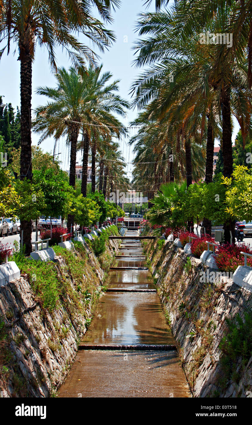 Storm drain running down middle of road, (vertical) Stock Photo