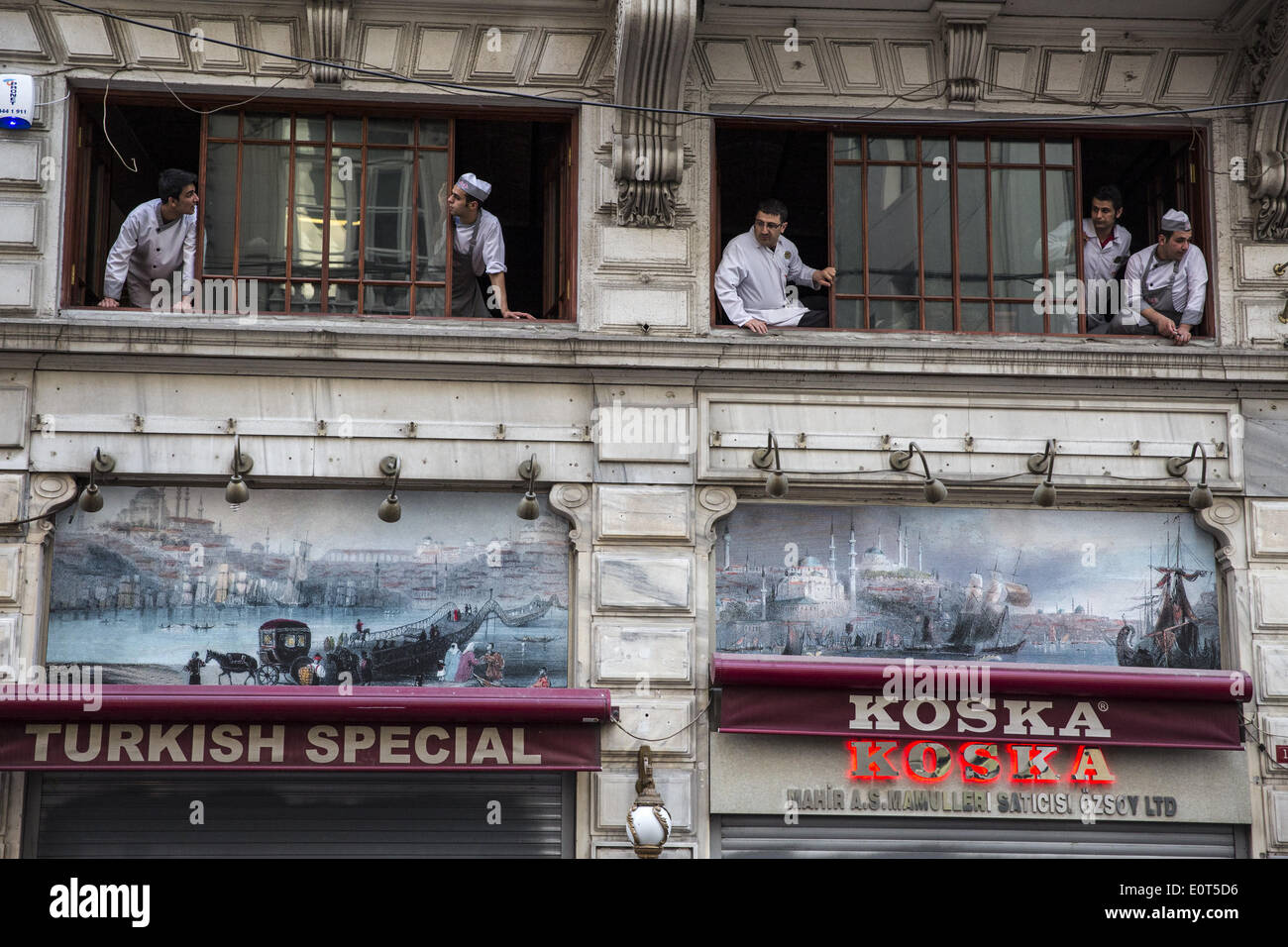 Istanbul, Turkey. 17th May, 2014. Workers at the Turkish candy company Koska watch as protesters clash with police in Istanbul on May 17, 2014. Anger has been mounting across the country regarding the government's handling and responsibility in the Soma mine accident, the worst in Turkey's history, which killed at least 300 miners. PHOTO BY JODI HILTON/NURPHOTO © Jodi Hilton/NurPhoto/ZUMAPRESS.com/Alamy Live News Stock Photo
