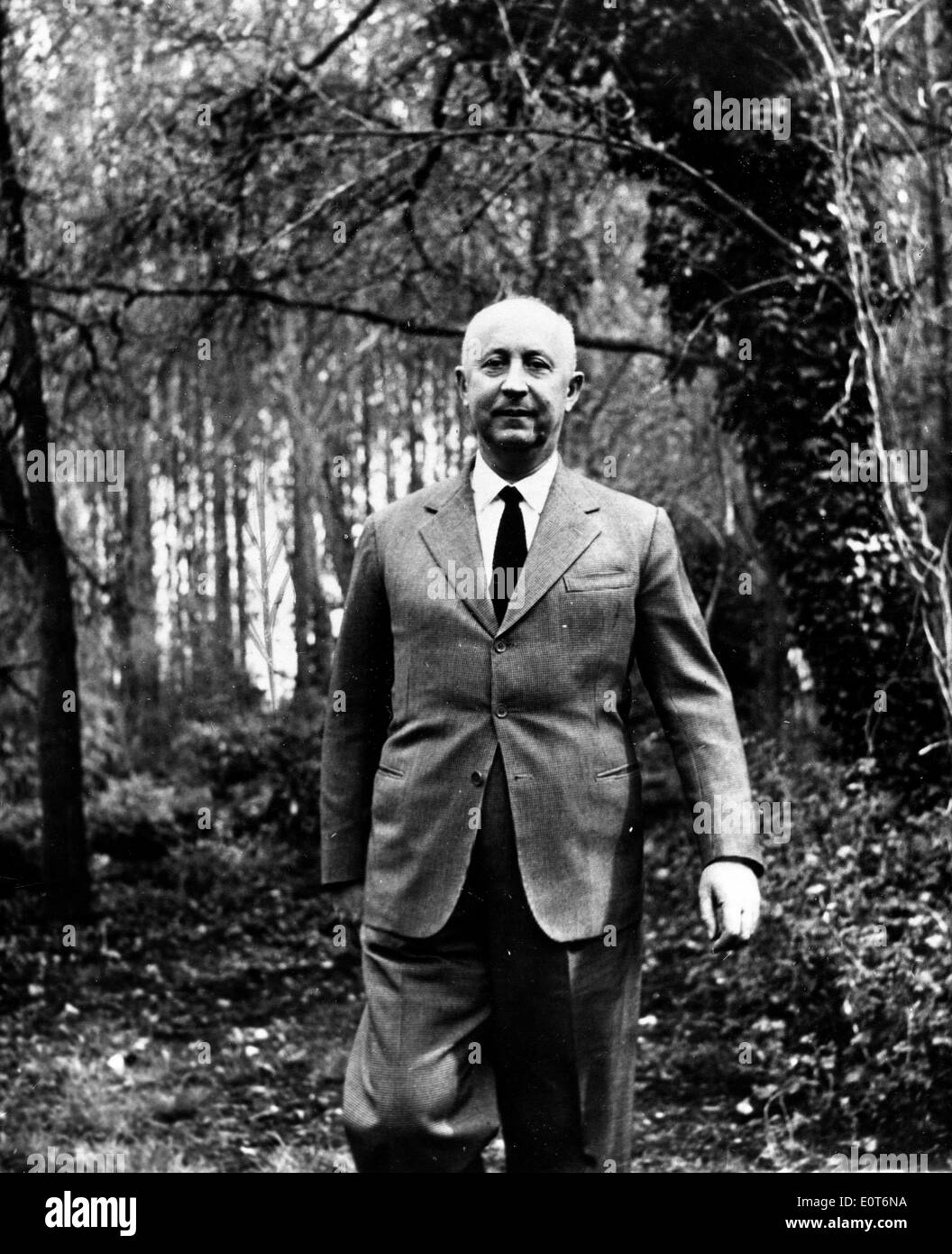 Fashion designer Christian Dior walking in the woods Stock Photo