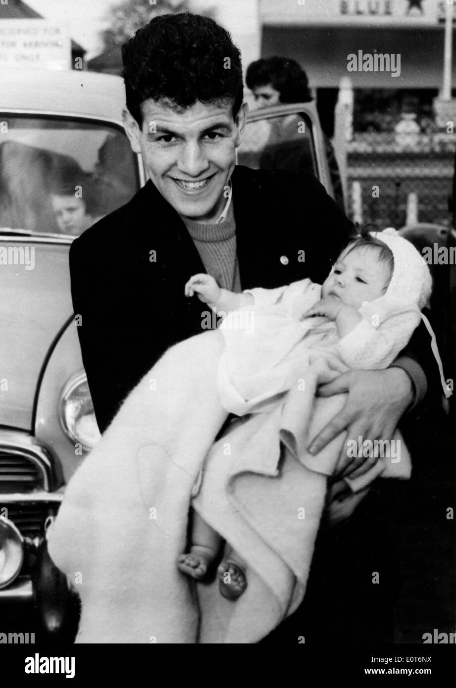Boxer Dai Dower holding a baby Stock Photo
