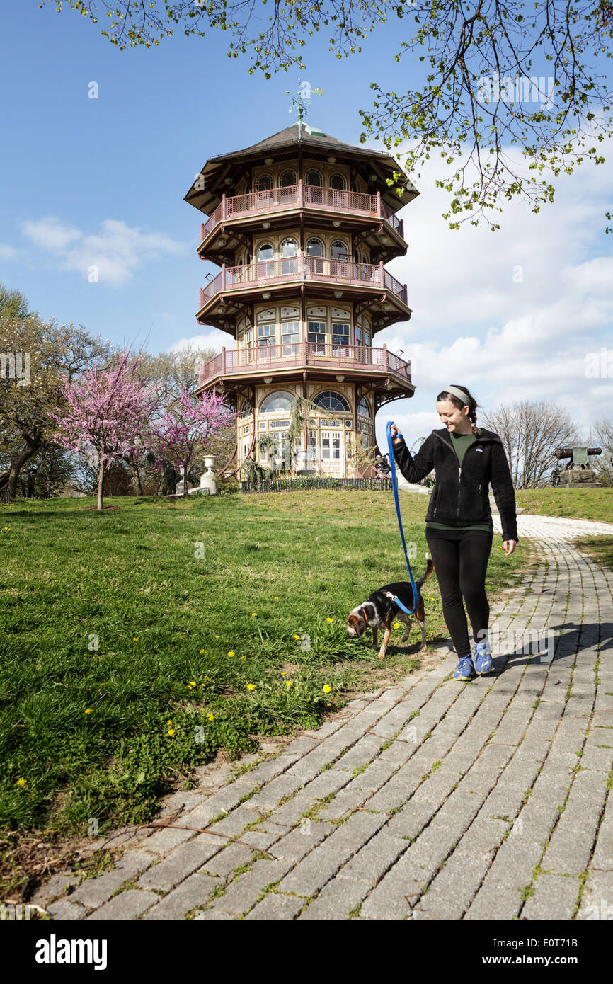 Woman walking her dog by the gazebo at Patterson Park, Baltimore, Maryland, USA Stock Photo