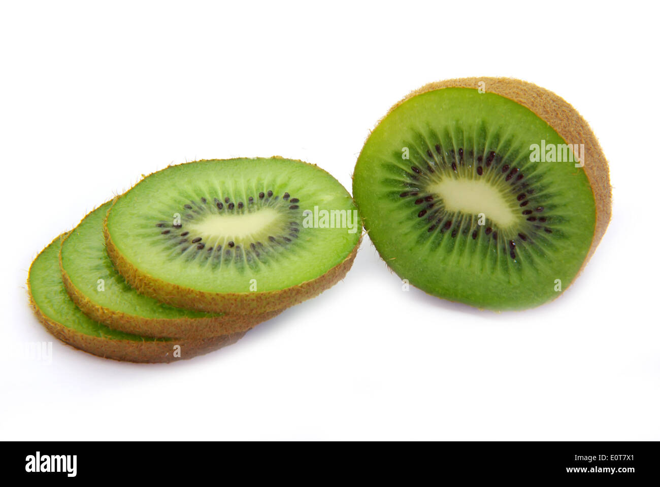 Freshly cut kiwi fruit on white background. Stock Photo