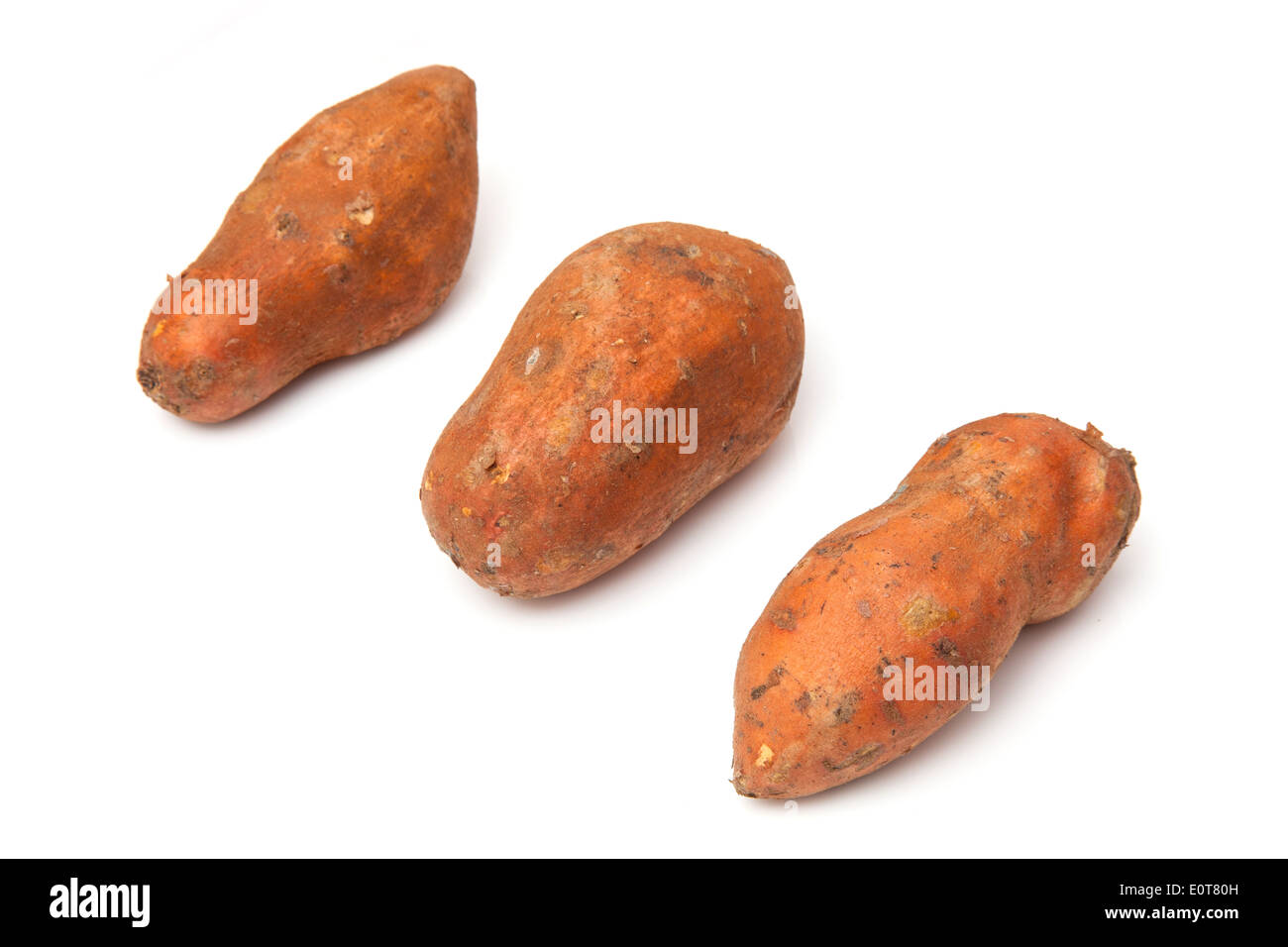 Sweet Potatoes isolated on a white studio background. Stock Photo