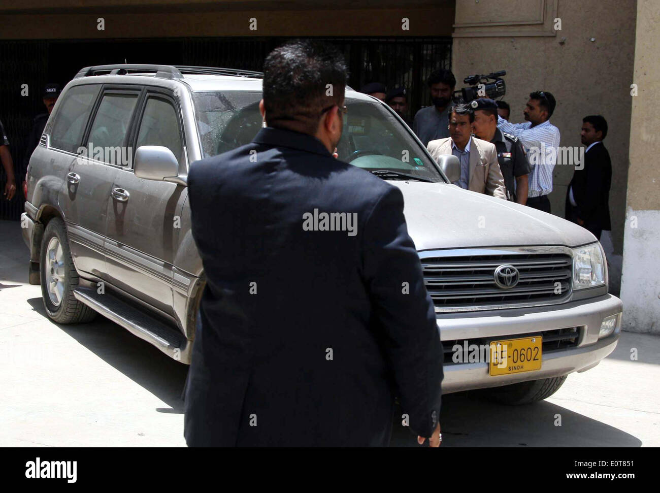 A secret agent reportedly named as Joel Cox affiliated with US Intelligence agency, Federal Bureau of Investigation (FBI), is being comes out after case haring against the alleged in carrying illegal weapon, at Malir Court in Karachi on Monday, May 19, 2014. A local court ordered that the case against Federal Bureau of Investigations (FBI) agent Joel Cox who was apprehended at the Jinnah International Airport on May 5 for carrying ammunition should be dropped. Stock Photo