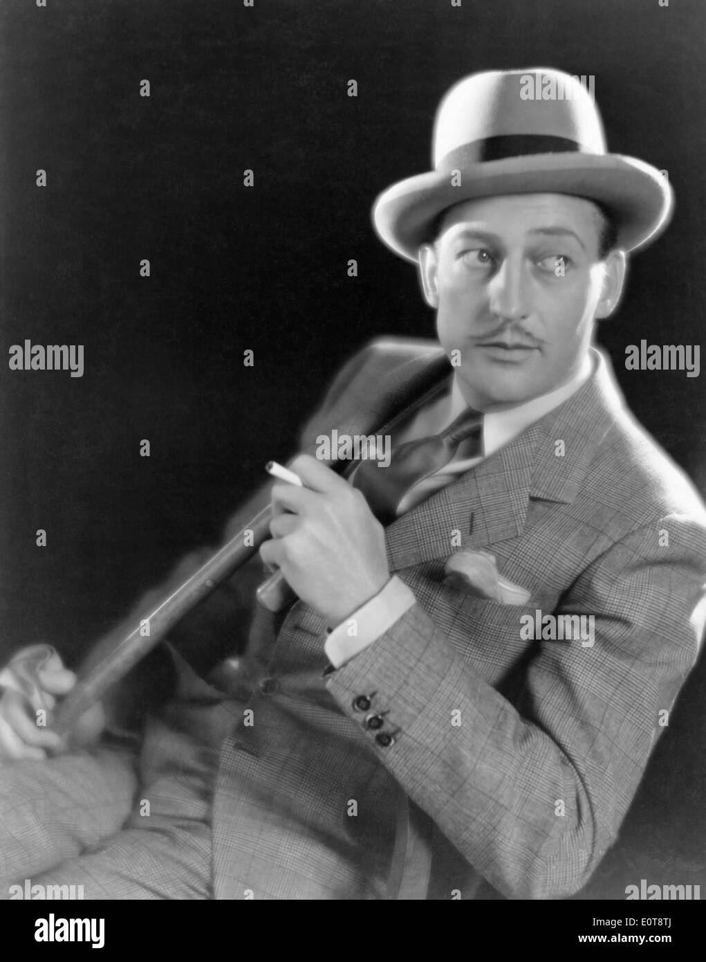 Warren William, American Actor, Portrait Smoking Cigarette, ca. 1934 Stock Photo