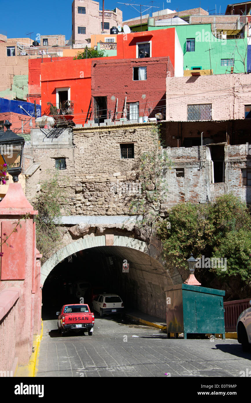 Entrance to road tunnel with multi coloured houses above Guanajuato Mexico Stock Photo