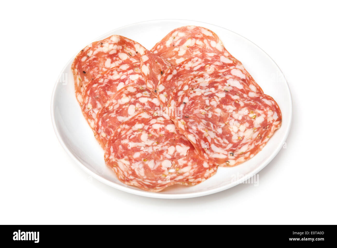 Plate of Salame Finocchiona pork salami with fennel seeds isolated on