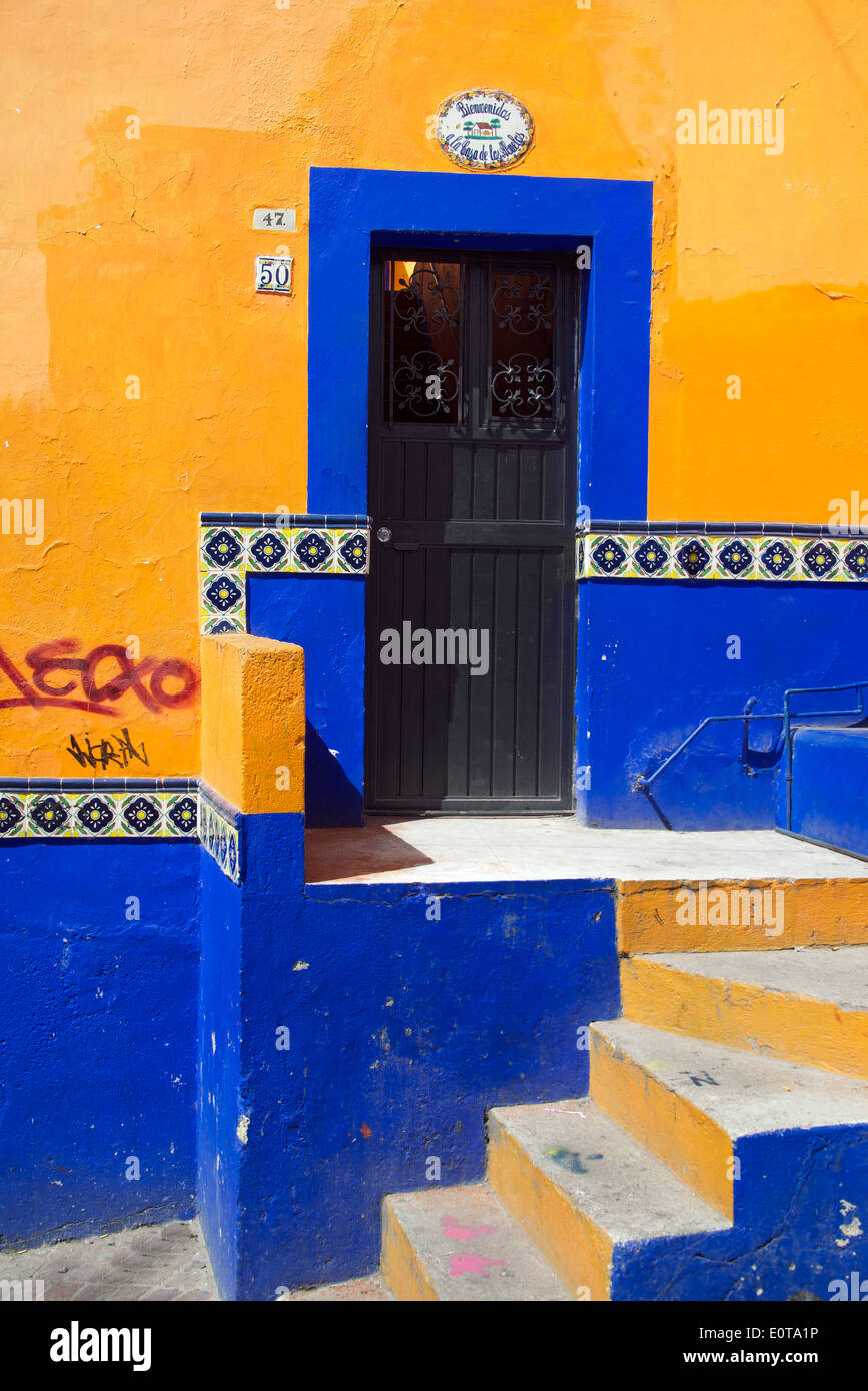 Front door and facade to brightly painted house Guanajuato Mexico Stock Photo