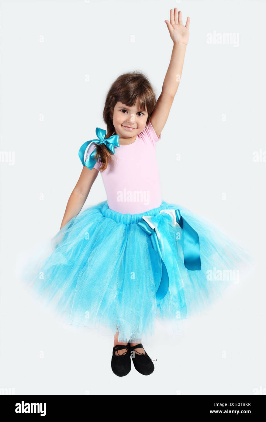 Smiling Girl in Tutu Skirt Hand Up Studio Shot Stock Photo