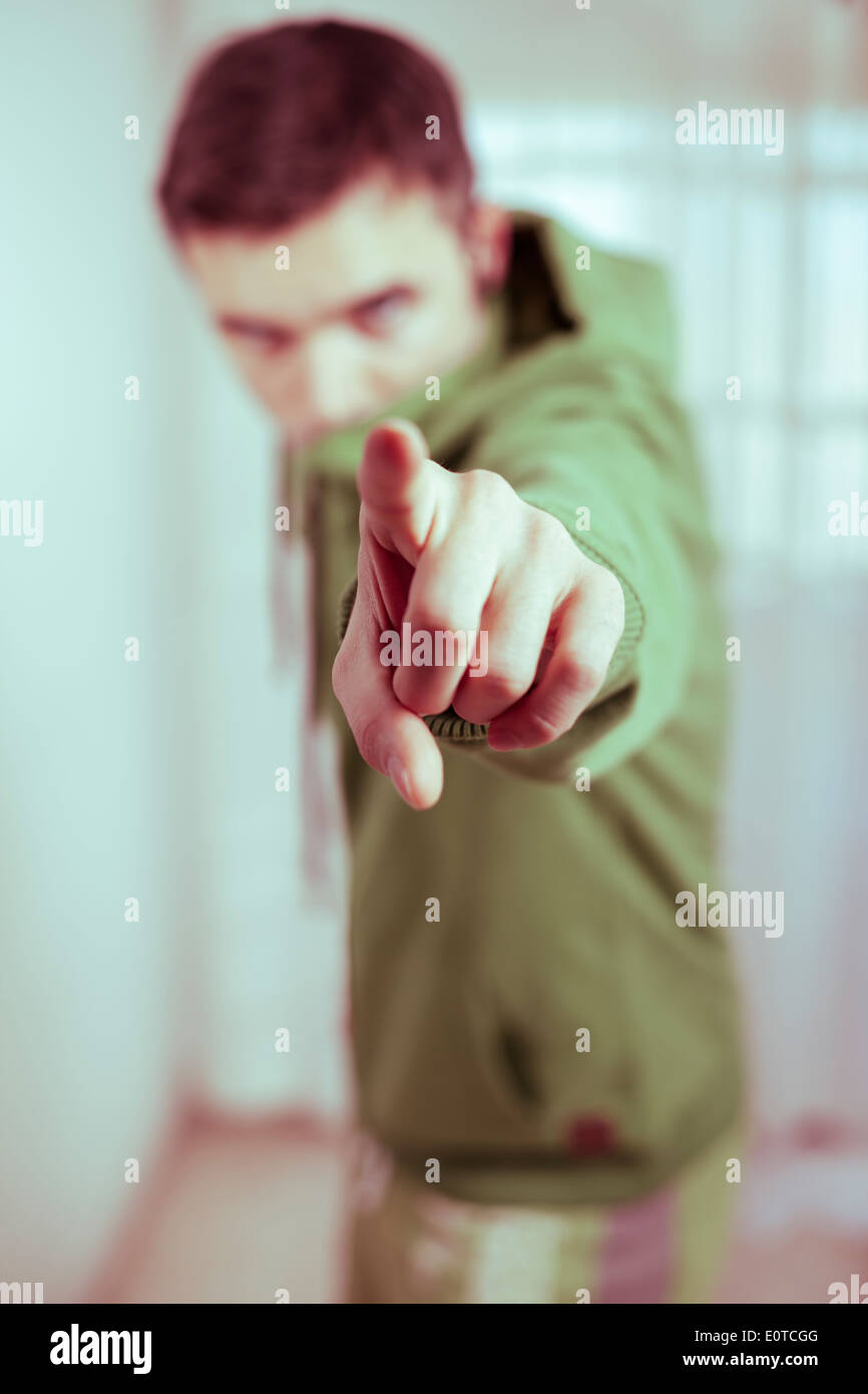 Portrait of serious man pointing at you. Stock Photo
