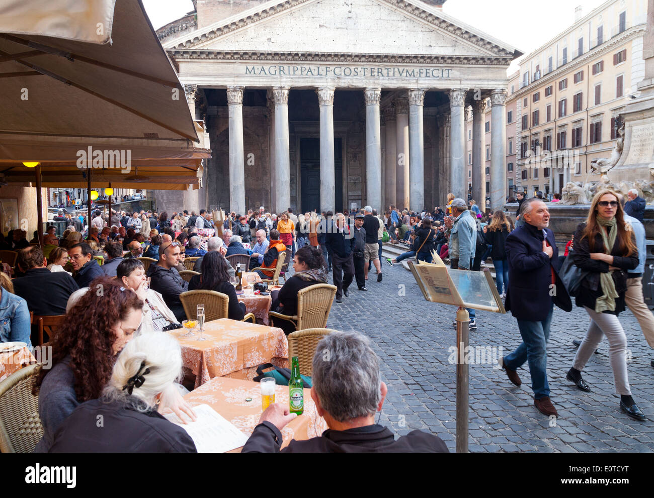 People drinking and eating outdoors at a street cafe by the Pantheon, Piazza della Rotonda, Rome Italy Europe Stock Photo