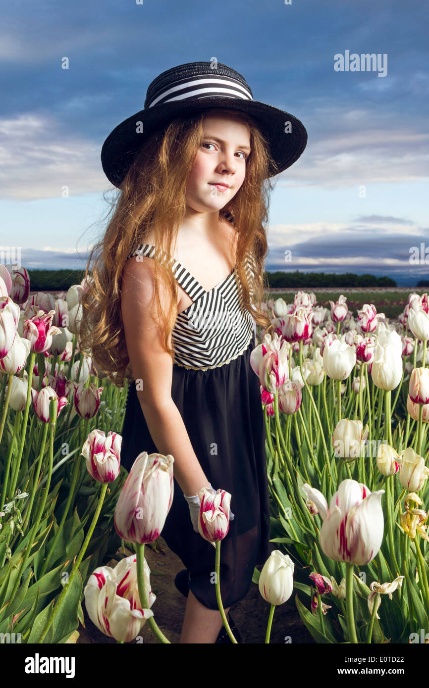 Young girl enjoying a tulip field Stock Photo