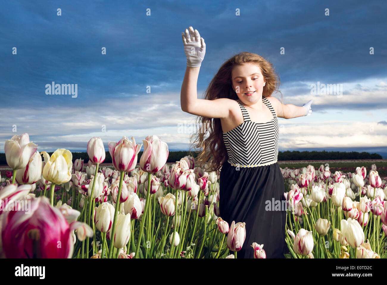 Girl child running through field hires stock photography and images