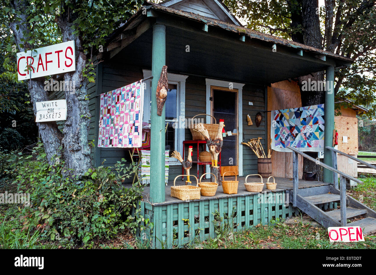Quilts, woven baskets and other American handicrafts are offered for sale at this rural home in the Ozark Mountains at Brashears, Arkansas, USA. Stock Photo