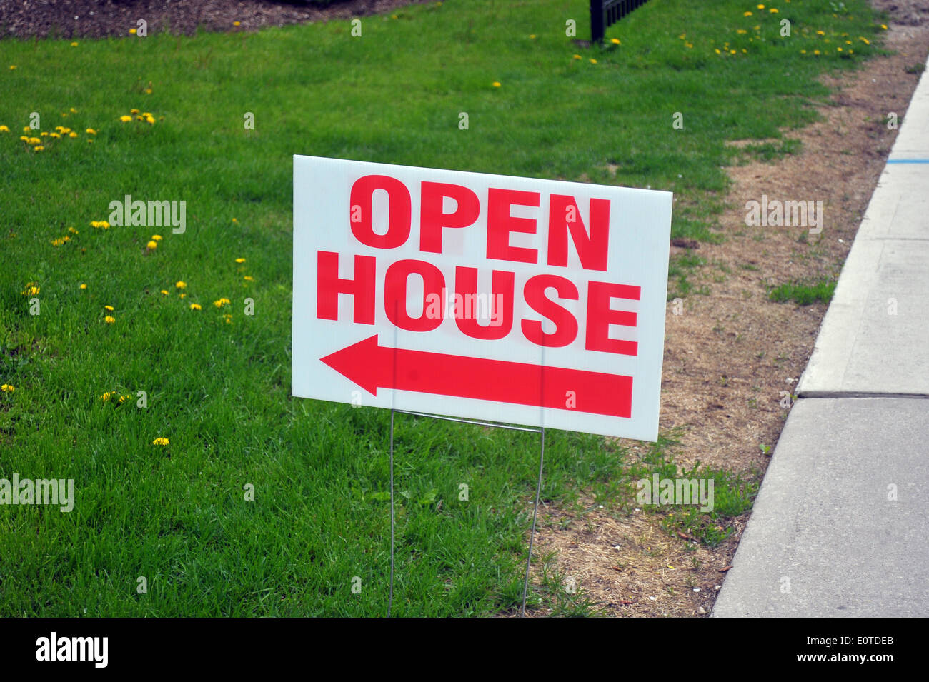 An Open House poster on the side of the pavement. Stock Photo