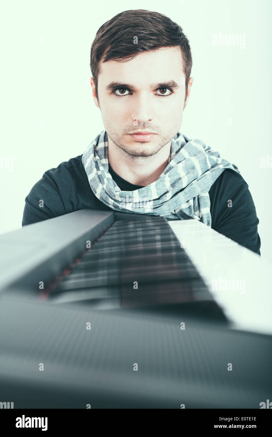 Portrait of a man with piano. Stock Photo