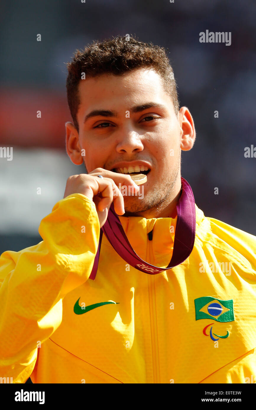 Alan Fonteles Cardoso Oliveira of Brazil celebrates with his gold medal following the Men's 200m - T44 final at the Olympic Stadium during the London 2012 Paralympic Games, London, Britain, 03 September 2012. Stock Photo