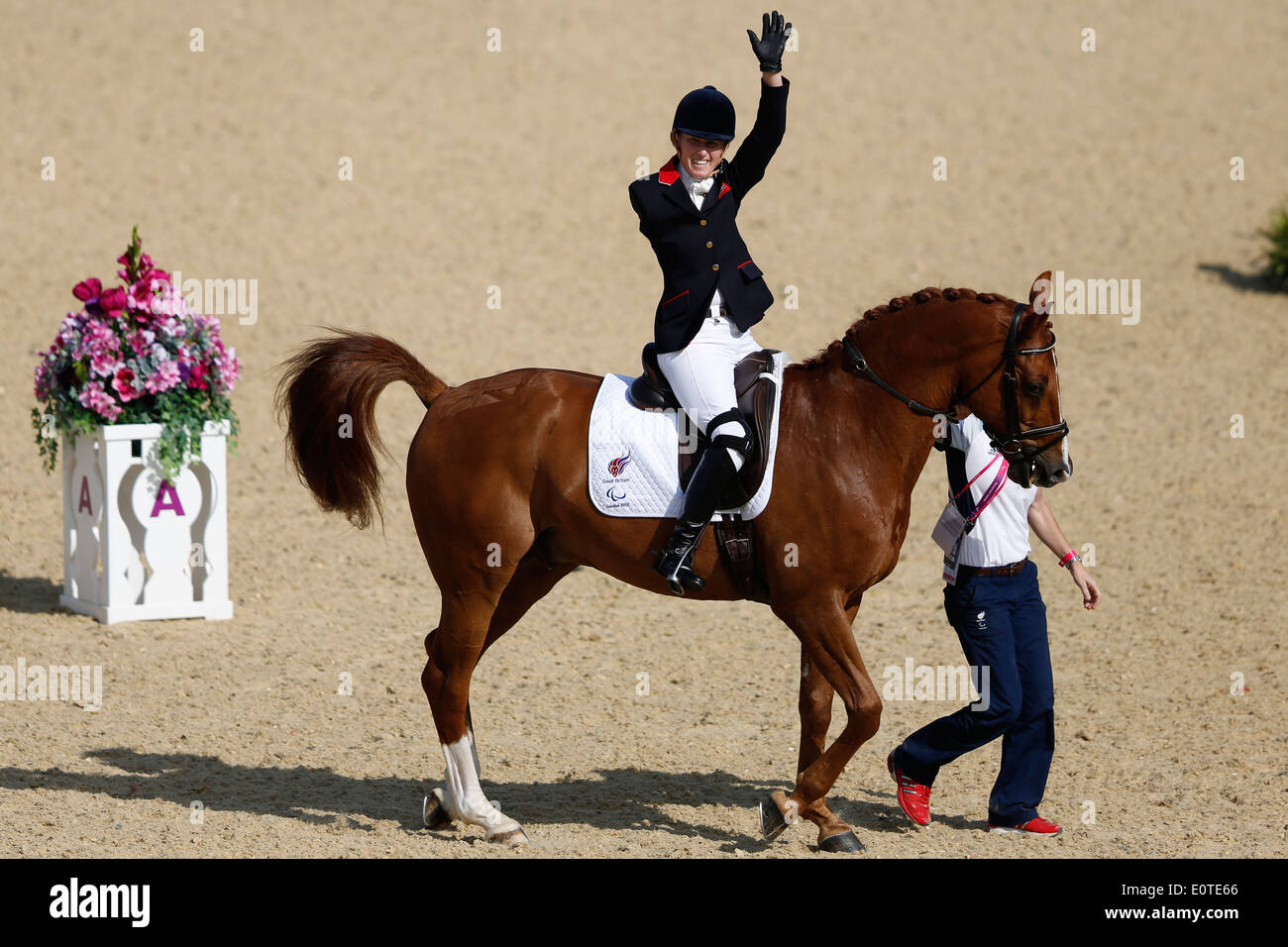 Deborah Criddle of Britain riding LJT Akilles waves to fans after competing in the Equestrian Dressage Individual Freestyle Test Grade IV event at Greenwich Park during the London 2012 Paralympic Games in London, Britain, 04 September 2012. Criddle won the silver medal. Stock Photo
