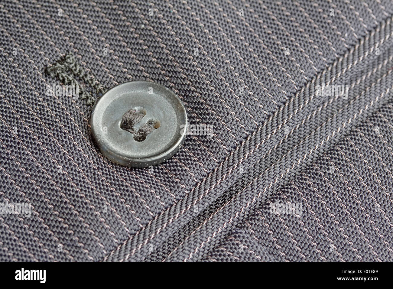 Close up pocket button on formal suit trousers Stock Photo