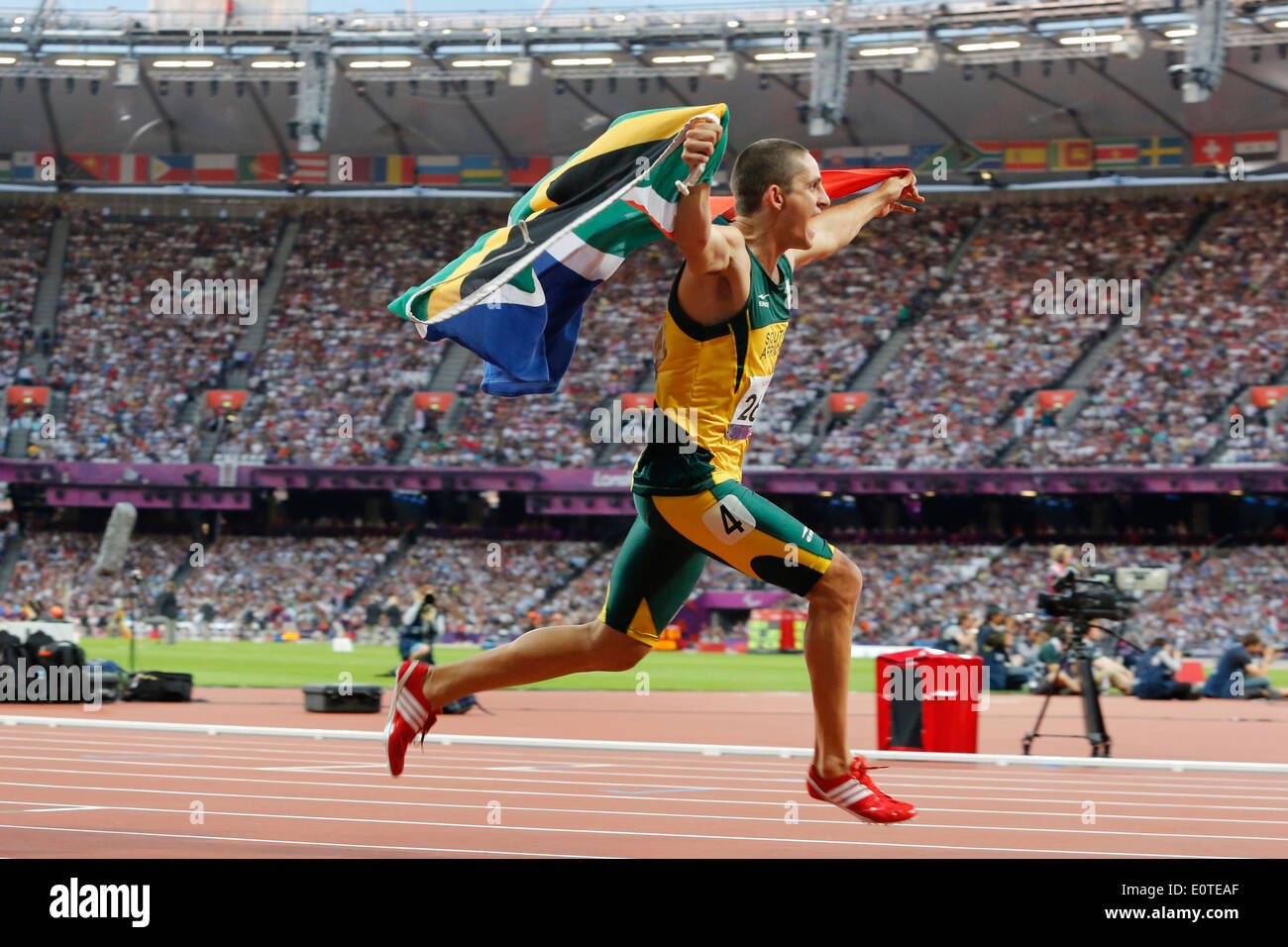 Fanie van der Merwe of South Africa celebrates winning gold following the men's 100m - T37 final at the Olympic Stadium during the London 2012 Paralympic Games, London, Britain, 08 September 2012. Stock Photo