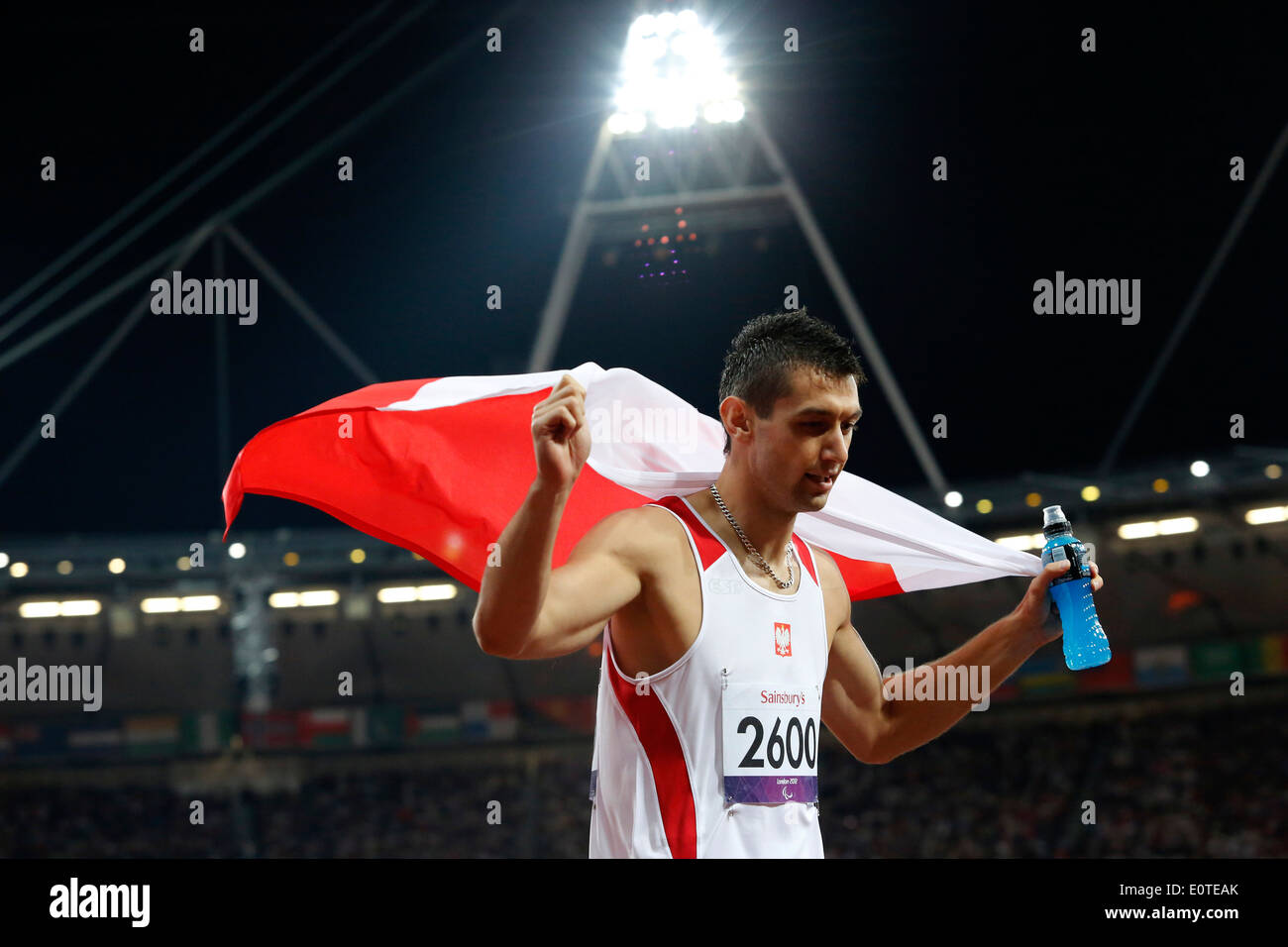 Mateusz Michalski of Poland celebrates winning gold following the men's 200m - T12 final at the Olympic Stadium during the London 2012 Paralympic Games, London, Britain, 08 September 2012. Stock Photo