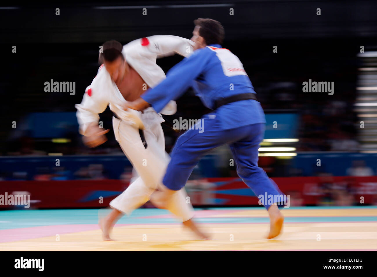 Anatoly Shevchenko of Russia (white) fights against Amir Seyed Nattajsolhdar Mirhassan of Iran (blue) during the men's final of repechage -81kg London 2012 Paralympic Games Judo competition in London, Britain, 31 August 2012. Stock Photo