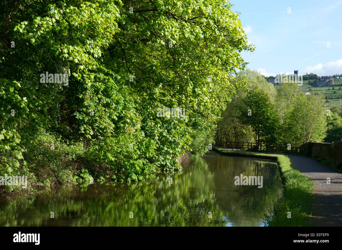 Rochdale Canal with Sowerby church in background, West Yorkshire Stock Photo