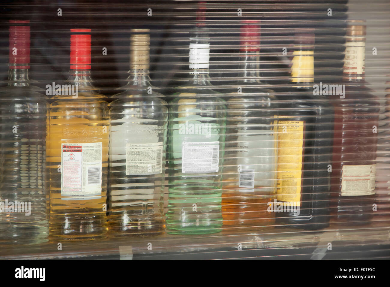 Liquor bottles in restaurant bar window. Stock Photo
