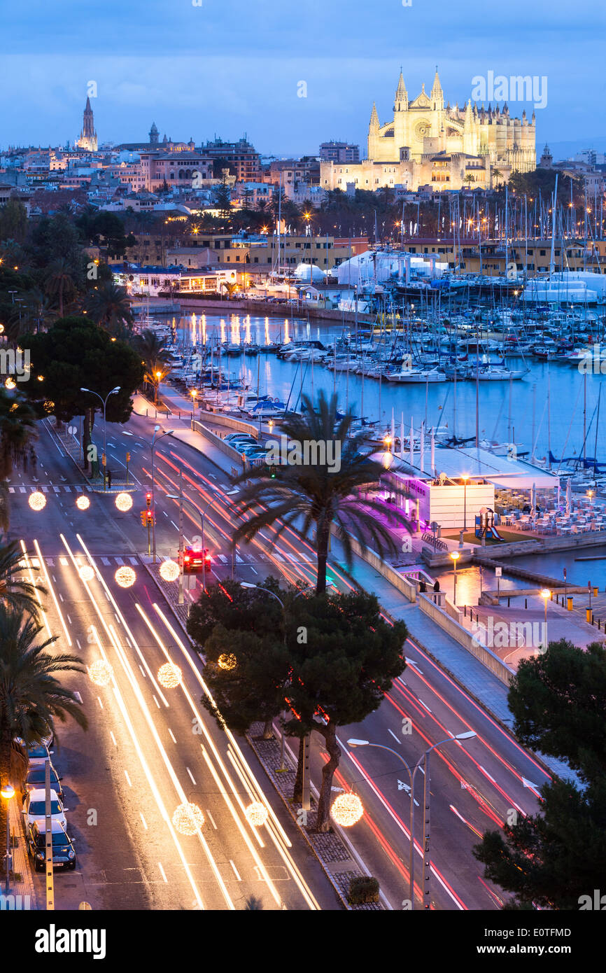 Long exposure of Palma de Mallorca avenue at sunset with Cathedral in background Stock Photo