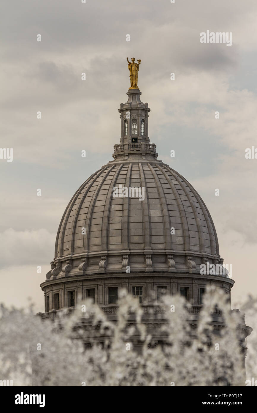 statue of "Miss Forward" on top of the capitol building in Madison