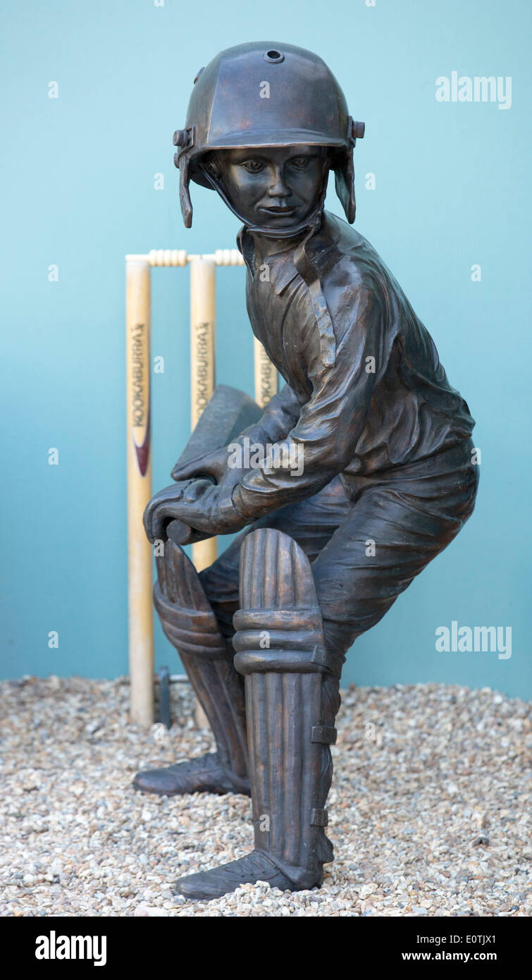 London, UK. 19 May 2014. Statue of a Cricket Player. The RHS Chelsea Flower Show opens its doors to VIPs and Celebrities for a preview on Press Day Monday. It opens to the general public from Tuesday. Photo: Nick Savage/Alamy Live News Stock Photo